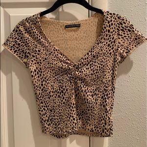 SOLD ON CURTSY Brandy Melville “Gina” cheetah top